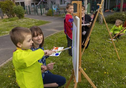 Le Rondin student painting outside